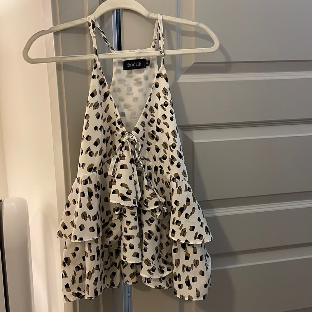 V-neck peplum leopard tank with side zip detail